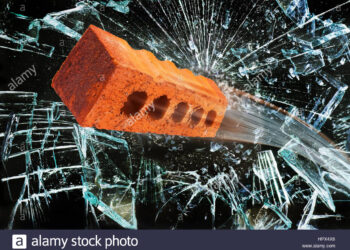 Trucks damaged as bricks hurled from bridge
