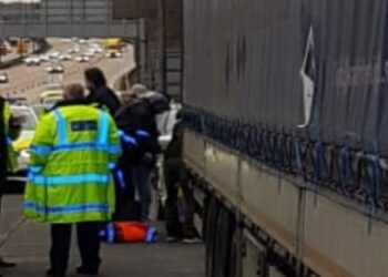 Driver held after 16 migrants found in M25 lorry