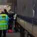 Driver held after 16 migrants found in M25 lorry