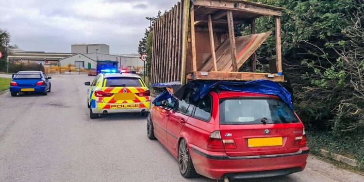 Driver stopped for attempting 30-mile journey with ‘shed’ perched on car roof