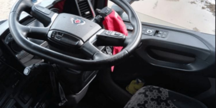 Trucker fined for sitting in friend’s passenger seat