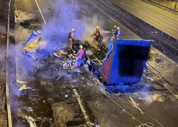 Trucker rescued after bridge strike fire