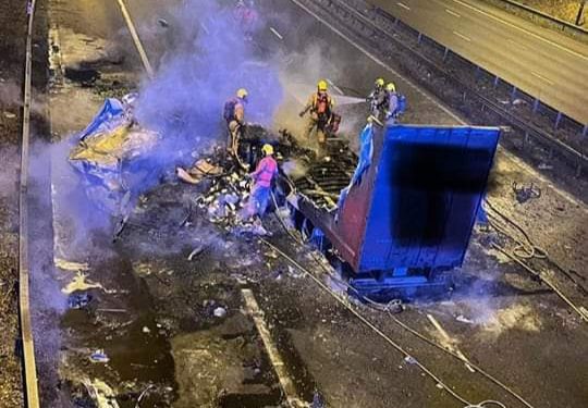 Trucker rescued after bridge strike fire